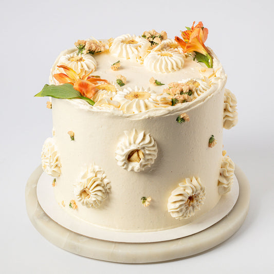 Vanilla-Mylk Chiffon Cake with Fresh Coconut, Glazed Bananas & Cream & Coconut Buttercream